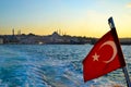 Bosphorus Strait in Istanbul, view of the Blue Mosque, Turkish flag, photographed from a boat, Turkey Royalty Free Stock Photo