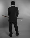Boss, Aggressive businessman with Japanese swords in defensive a Royalty Free Stock Photo