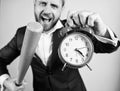 Boss aggressive face hold alarm clock and baseball bat. Man suit hold clock in hand and arguing for being late. Business