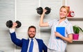 Boss businessman and office manager raise hand with dumbbells. Strong business team. Healthy habits in office. Man and Royalty Free Stock Photo