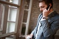 Boss in company talking on cell phone with business partner Royalty Free Stock Photo