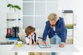 Boss and employee. Little boss and employee in the office. Old and yong business concept. Kids director business man in Royalty Free Stock Photo