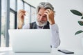 Boss in formal clothes works in office. Senior stylish modern man with grey hair and beard indoors