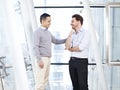 Boss giving subordinate a pat on the shoulder Royalty Free Stock Photo