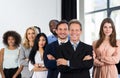 Boss With Group Of Businesspeople In Creative Office, Mature Successful Businessman Leading Business People Team Stand Royalty Free Stock Photo