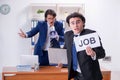 Boss and his male assistant working in the office Royalty Free Stock Photo