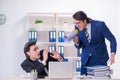 Boss and his male assistant working in the office Royalty Free Stock Photo