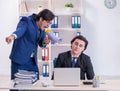 Boss and his male assistant working in the office Royalty Free Stock Photo