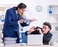 Boss and his male assistant working in the office Royalty Free Stock Photo