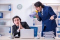 Boss and his male assistant working in the office Royalty Free Stock Photo