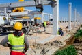 Boss oversees, control work on construction site