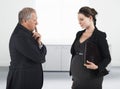 Boss And Pregnant Businesswoman In Office