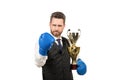 boss show victory and authority. businessman in boxing gloves with trophy. Royalty Free Stock Photo