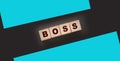 The boss sign on a wooden cubes on black. Business owner concept