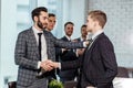 Young caucasian boss congratulate best worker of company