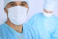 Boss surgeon is examining the operation while medical team are busy of patient. Medicine, healthcare and emergency in Royalty Free Stock Photo