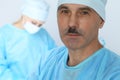 Boss surgeon is examining the operation while medical team are busy of patient. Medicine, healthcare and emergency in Royalty Free Stock Photo