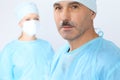 Boss surgeon is examining the operation while medical team are busy of patient. Medicine, healthcare and emergency in Royalty Free Stock Photo