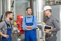 Boss with two worker in conversation Royalty Free Stock Photo