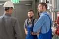 Boss with two worker in conversation Royalty Free Stock Photo