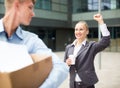 Boss woman is wishing good luck to office worker