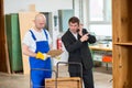 Boss and worker in carpenter's workshop Royalty Free Stock Photo