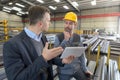 Boss and worker in conversation in factory Royalty Free Stock Photo