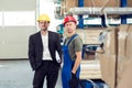 Boss and worker in stockroom Royalty Free Stock Photo