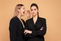 Boss yelling at employee. Colleague screaming on worker. Bulling on work. One woman shouting another woman standing isolated color Royalty Free Stock Photo