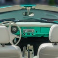 BOSSCHENHOOFD/NETHERLANDS-JUNE 11, 2018: interior and dash board of a mint green volkswagen kamann ghia at a classic car meetin