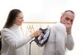 wife forces husband to iron clothes Bossy wife command husband to launder in washing machine. Routine weekend activity Royalty Free Stock Photo