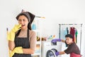 Bossy wife laugh to let her husband laundry alone Royalty Free Stock Photo