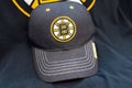 Boston bruins logo on a shirt and hat Royalty Free Stock Photo