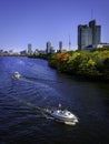 Boston Cityscape with Autumn Foliage and Racing Boats in the Charles River Royalty Free Stock Photo