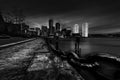 Boston Harbor with high rise in background and steel chain