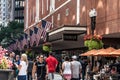 Boston, MA USA 06.09.2017 - Macy`s Shopping Mall Store with people walking and american flag waving