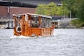 Orange Boston Duck Tours D.U.K.W Amphibian Vehicle, Olga Ironsides, on The Charles River.