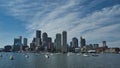 Boston Massachusetts harbor and city skyline over water with sailboats