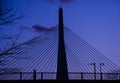 A Boston pedestrian at dusk with the Zakim Bridge looming in the background. Royalty Free Stock Photo