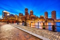 Boston Skyline with Financial District and Boston Harbor at Dusk Royalty Free Stock Photo