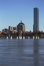 Boston Skyline, sail boats and Prudential Bld. in winter on half frozen Charles River, Massachusetts, USA Royalty Free Stock Photo