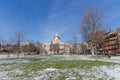 Boston, USA - December 08, 2019: Winter day in the public park with snow and the view of Boston State House