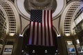 Boston, USA - October 22, 2021: American flag hanging at night from the doom ceiling in Boston Harbor, Massachusetts