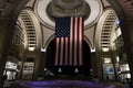 Boston, USA - October 22, 2021: American flag hanging at night from the doom ceiling in Boston Harbor, Massachusetts