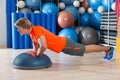 Bosu diamond push up blond man gym exercise Royalty Free Stock Photo