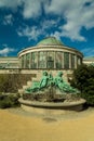 Greenhouse and a sculpture in a Botanic garden in Brussels, Belgium Royalty Free Stock Photo