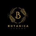 Botanic vector logo. Luxury letter monogram. Fashion brand identity. Golden Leaves Plant Logo design. Hotel or boutique emblem