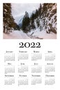 Botanical calendar for 2022. Printable wall calendar, week starts on Monday. Beautiful winter landscape in the Polish mountains