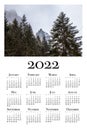 Botanical calendar for 2022. Printable wall calendar, week starts on Monday. Beautiful winter landscape in the Polish mountains