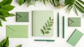 Botanical Flat Lay of Green Stationery Items Royalty Free Stock Photo